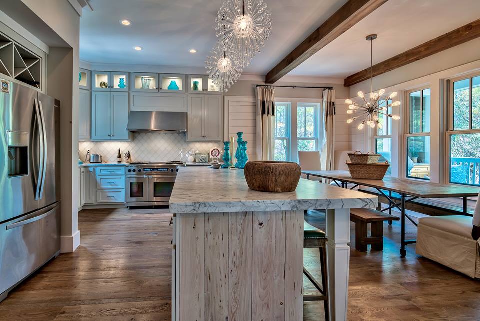 Large-open-kitchen-with-wood-flooring-light-fixtures-backsplash-light