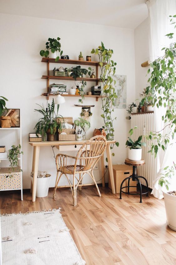 A-boho-home-office-done-in-neutrals-and-with-much-potted-greenery-including-cimbing-plants-for-a-calming-feel