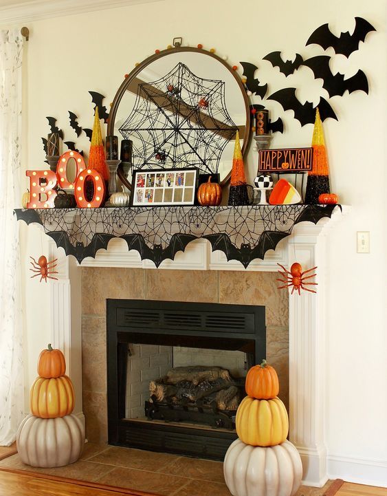 A-bright-and-fun-halloween-mantel-with-a-spiderweb-marquee-letters-bats-pumpkins-and-candy-corns-is-cool