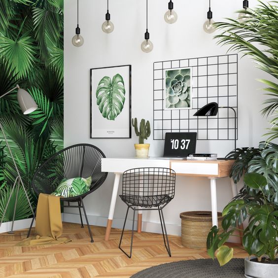 A-bright-tropical-home-office-with-a-tropical-leaf-wall-lots-of-potted-greenery-artworks-a-woven-basket-and-hanging-bulbs