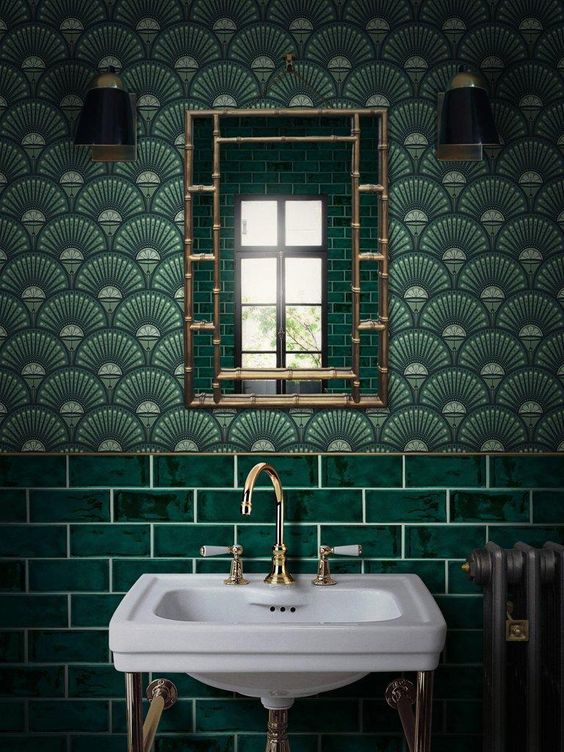 A-chic-art-deco-bathroom-in-green-shades-done-with-tiles-and-wallpaper-with-gold-and-brass-touches-looks-awesome