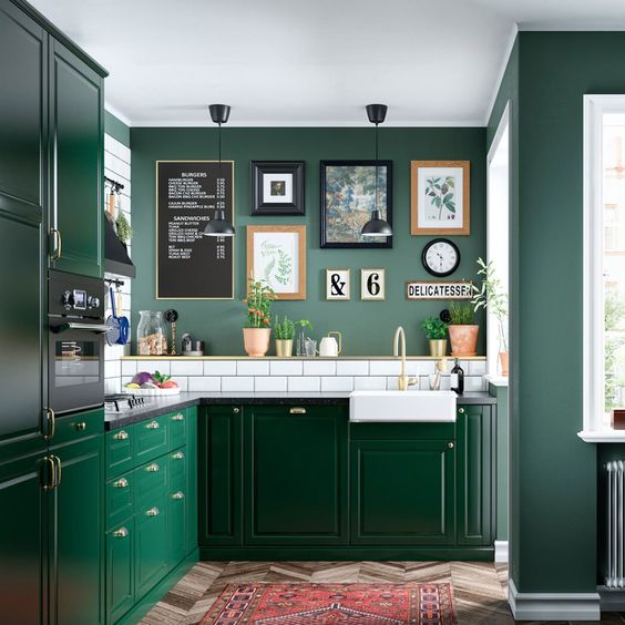 A-chic-green-kitchen-with-green-walls-bright-emerald-cabinets-a-white-subway-tile-backsplash-for-a-fresh-touch