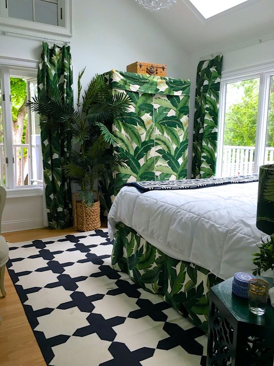 A-crazy-tropical-bedroom-done-in-a-monochromatic-color-scheme-and-spruced-up-with-tropical-prints-woven-touches-and-skylights