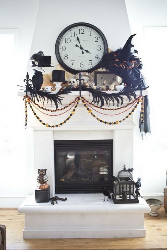 A-scary-old-fashioned-mantel-with-feathers-beads-top-hats-blackbirds-tassels-and-a-large-clock