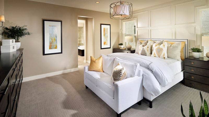 Master-bedroom-with-love-seat-at-foot-of-bed