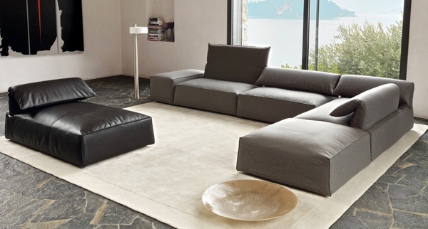 Modern-sectional-gray-sofa-natural-stone-floor-tile-sand-color-carpet