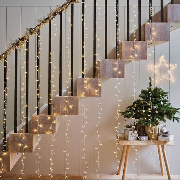 Most-beautiful-curtain-christmas-string-lights-in-staircase