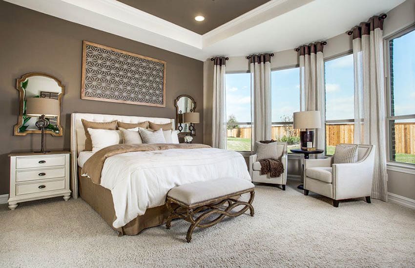 Staged-master-bedroom-with-dark-brown-paint-and-sitting-area