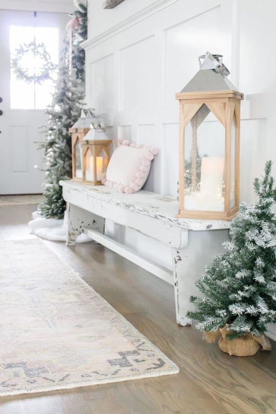 19-a-winter-wonderland-entryway-with-mini-flocked-christmas-trees-wooden-lanterns-a-shabby-chic-bench-with-a-pink-pillow