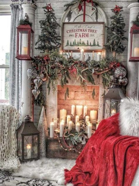 21-enchanting-vintage-christmas-decor-with-evergreens-candles-a-red-blanket-oversized-candle-lanterns-and-a-vintage-sign