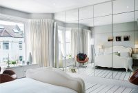 Bedroom with mirror on the wall