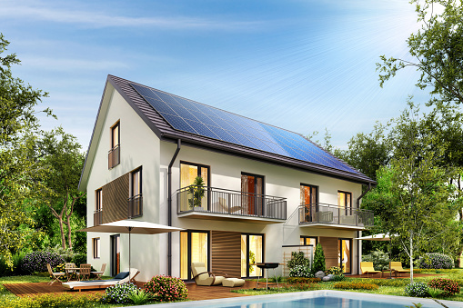 Townhouse with solar panels on the roof and a terrace and swimming pool