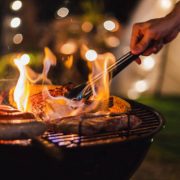 Family making barbecue in dinner party camping at night
