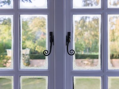 Condensation on double glazed wooden windows due to cold bridging, uk