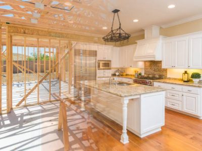 House construction framing gradating into finished kitchen build.