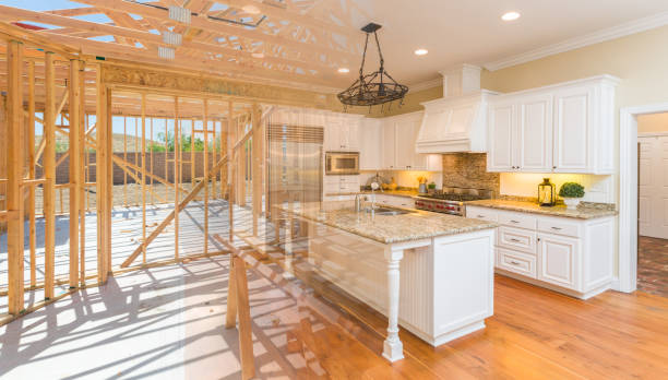House construction framing gradating into finished kitchen build.
