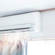 Air conditioner blowing warm air