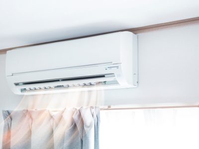 Air conditioner blowing warm air