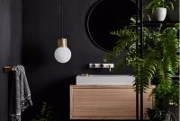 Black bathroom with greens
