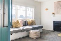 Drawers built beneath a couch in a living room