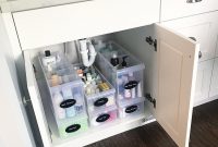 Under sink storage organization in bathroom