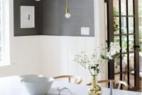 Beautiful dining room with grey grasscloth wallpaper