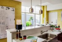 Catchy kitchen with yellow grasscloth wallpaper