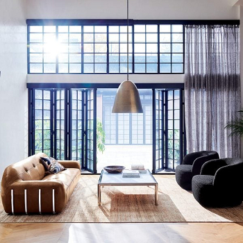 Boucle chair in black feat brown leather couch Types Of Accent Chair To Pair With Brown Leather Couch For The Best Look