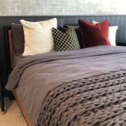 Close up of soft fluffy cushions on a comfortable bed