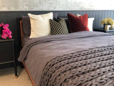Close up of soft fluffy cushions on a comfortable bed