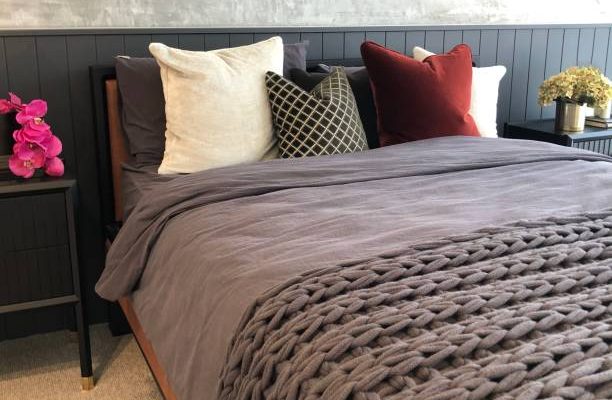 Close up of soft fluffy cushions on a comfortable bed