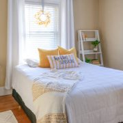 Cozy and stylish small bedroom decor in yellow and white