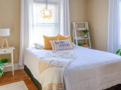 Cozy and stylish small bedroom decor in yellow and white