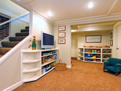 Play room in a white basement living room