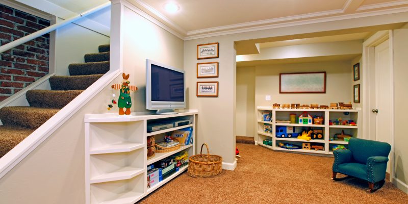 Play room in a white basement living room