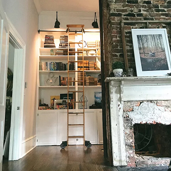 Adding castors to a wooden ladder in library How To Decorate Home With Repurposed Wooden Ladder Ideas For Charming Look