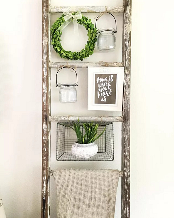 Hang a seasonal wreath How To Decorate Home With Repurposed Wooden Ladder Ideas For Charming Look