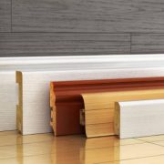 Set of skirting different form on a wood background. 3d illustration