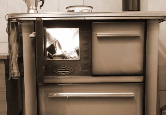 Old wood burning stove cooker in the kitchen