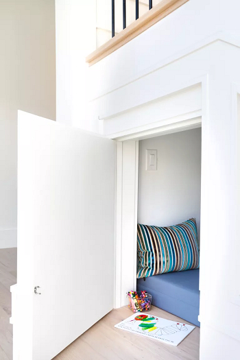 A cubby hole under the stairs as the reading nook Playful Practical Kids’ Reading Corners Design Ideas To Enjoy Creativity