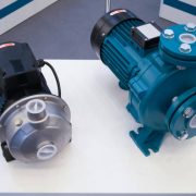 Two electric motorized portable water pumps at hardware store