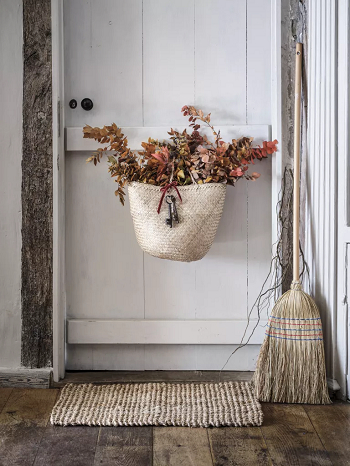 A door with a basket of fall foliage Indoor Outdoor Home Decoration Ideas To Have This Fall