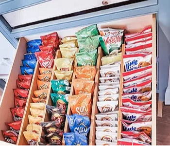 Organize snacks vertically Above Brilliant Ways To Organize Your Crowded Kitchen Drawers