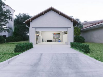 Open door of a modern garage with a concrete driveway at the urban district.