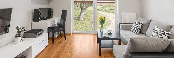 Panoramic view of modern designed grey living room