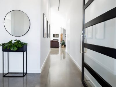 Contemporary home entry hall with polished concrete floors