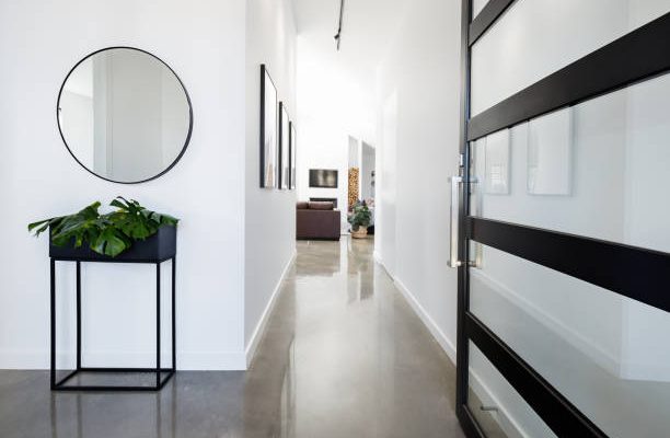 Contemporary home entry hall with polished concrete floors