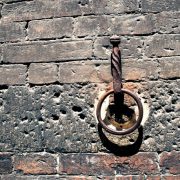 Antique iron ring on the brick wall of a historic building