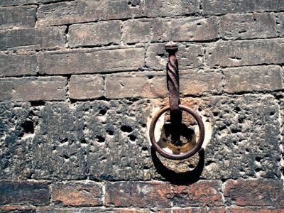 Antique iron ring on the brick wall of a historic building