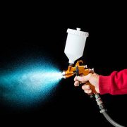 Airbrush paint sprayer isolated on black